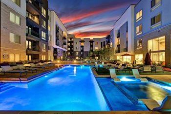 Sparkling swimming pool at night
